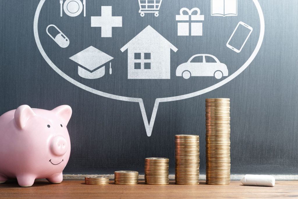 Stack of coins and piggy bank with multiple icons drawn on backdrop, representing best places to get a loan in Jurong