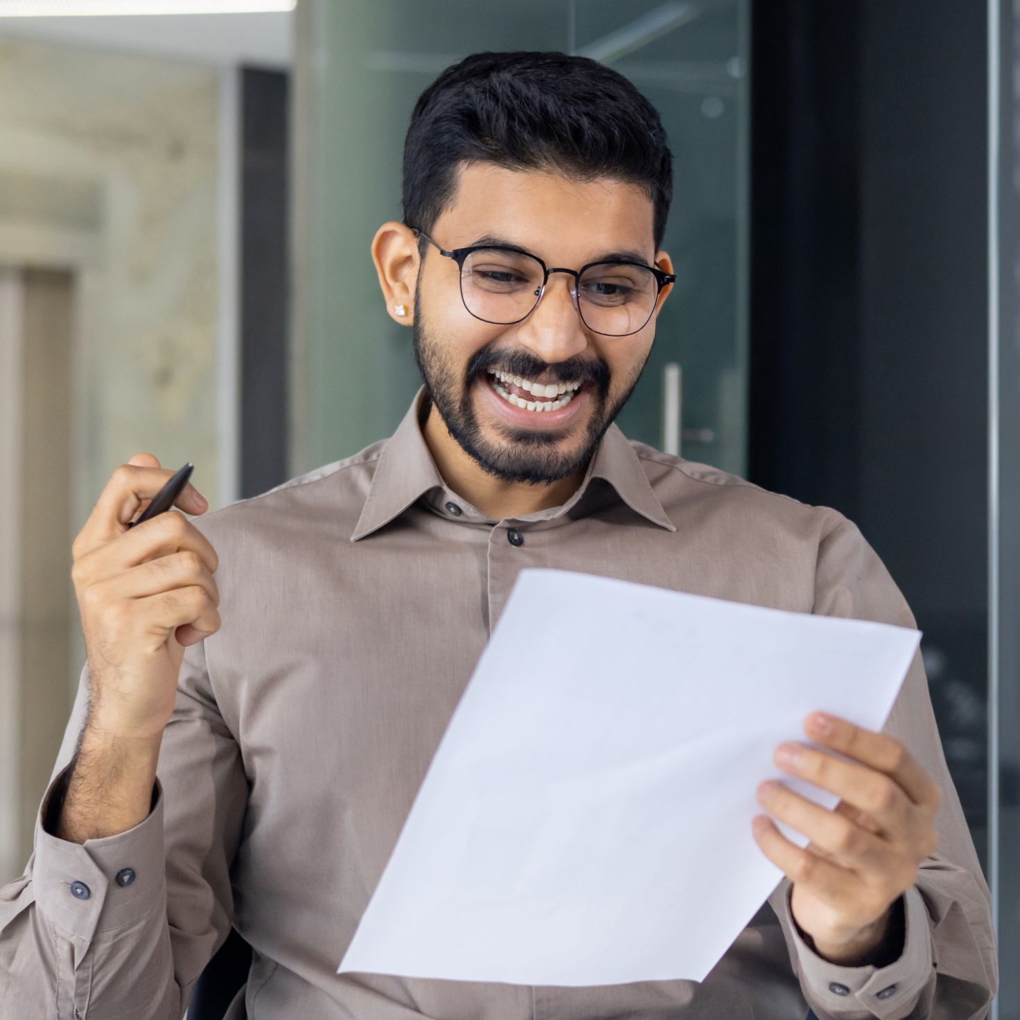 An asian man brimming with joy after a successful personal loan approval
